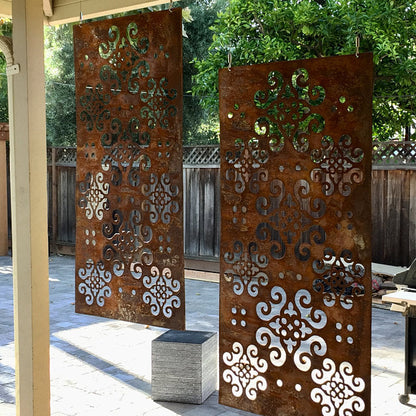 Two rusty metal privacy panels with ornate scrollwork, 46-inch sculptures for lawn decor on Tampa Home & Garden Store