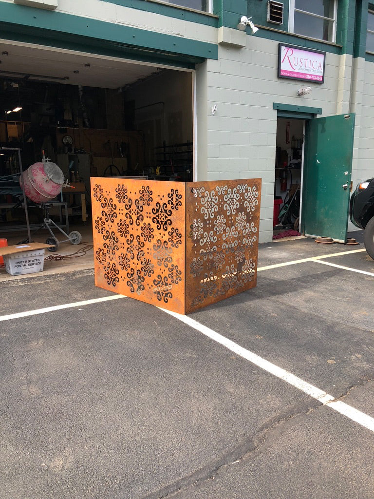 Outdoor privacy panels by Rustica Ornamentals, two rusted metal screens with intricate scrollwork on Tampa Home & Garden Store