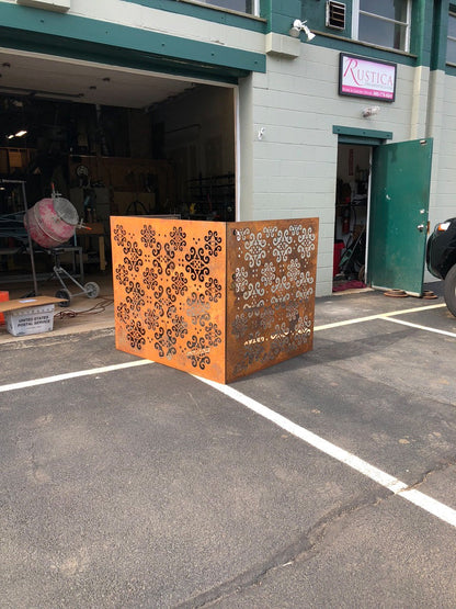Outdoor privacy panels by Rustica Ornamentals, two rusted metal screens with intricate scrollwork on Tampa Home & Garden Store