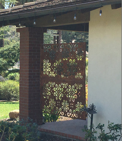 Outdoor metal privacy screen panel rust color with ornate scrollwork heavy steel for patio fence on Tampa Home & Garden Store