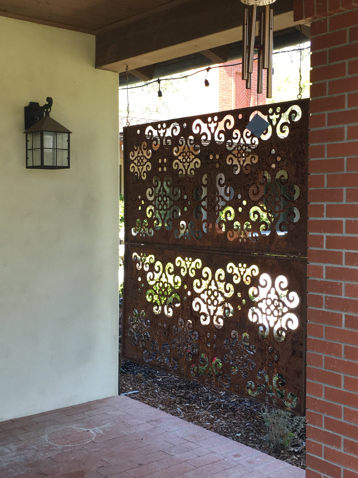 Rusted metal privacy panel gate with ornate scrollwork 46in tall Rustica Ornamentals on Tampa Home & Garden Store