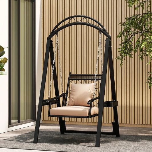 Outdoor porch swing with removable beige cushions on black metal frame with chains on Tampa Home & Garden Store