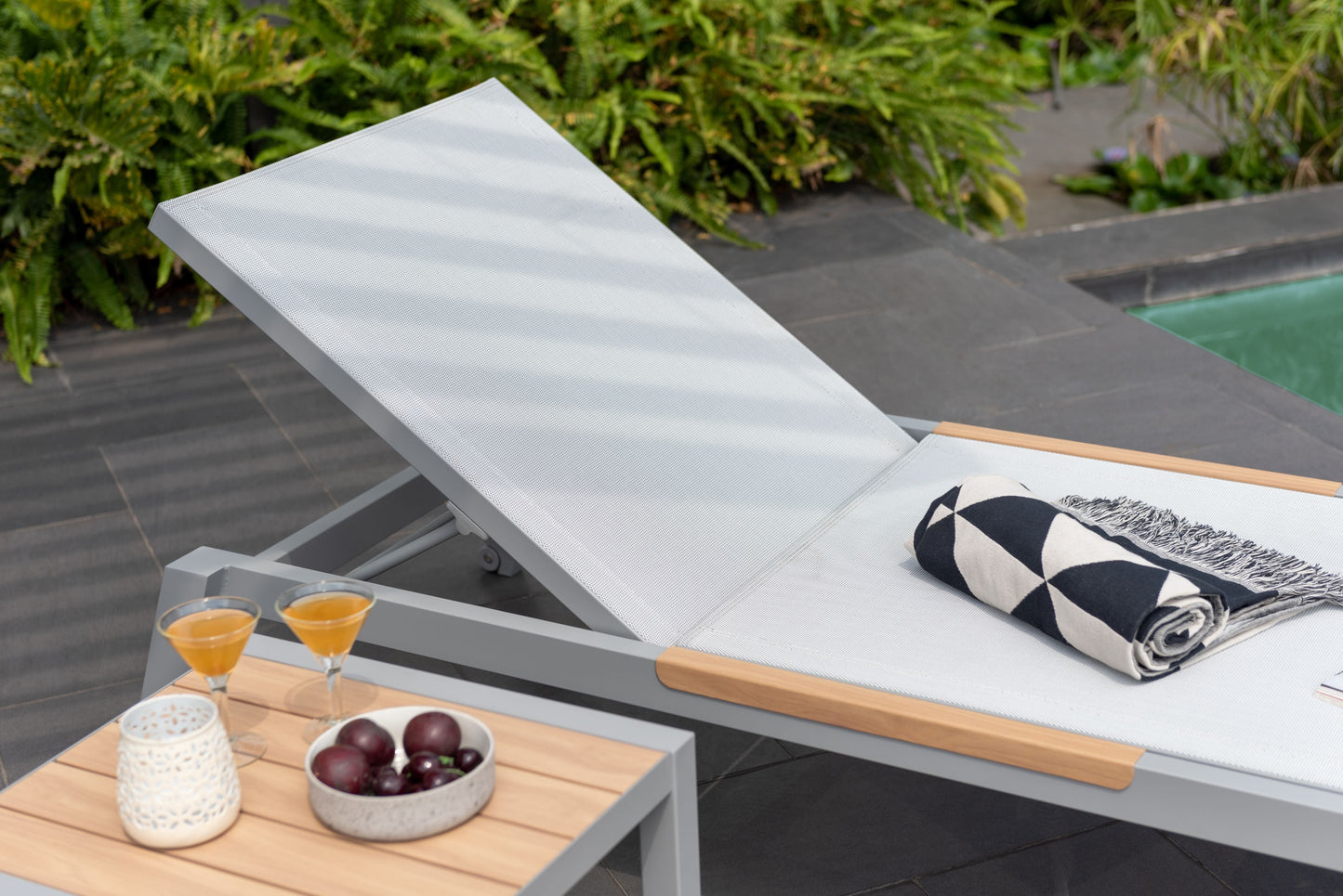Panama Light Sun Lounger in light grey mesh with wood accents, 1pc, poolside setup on Tampa Home & Garden Store