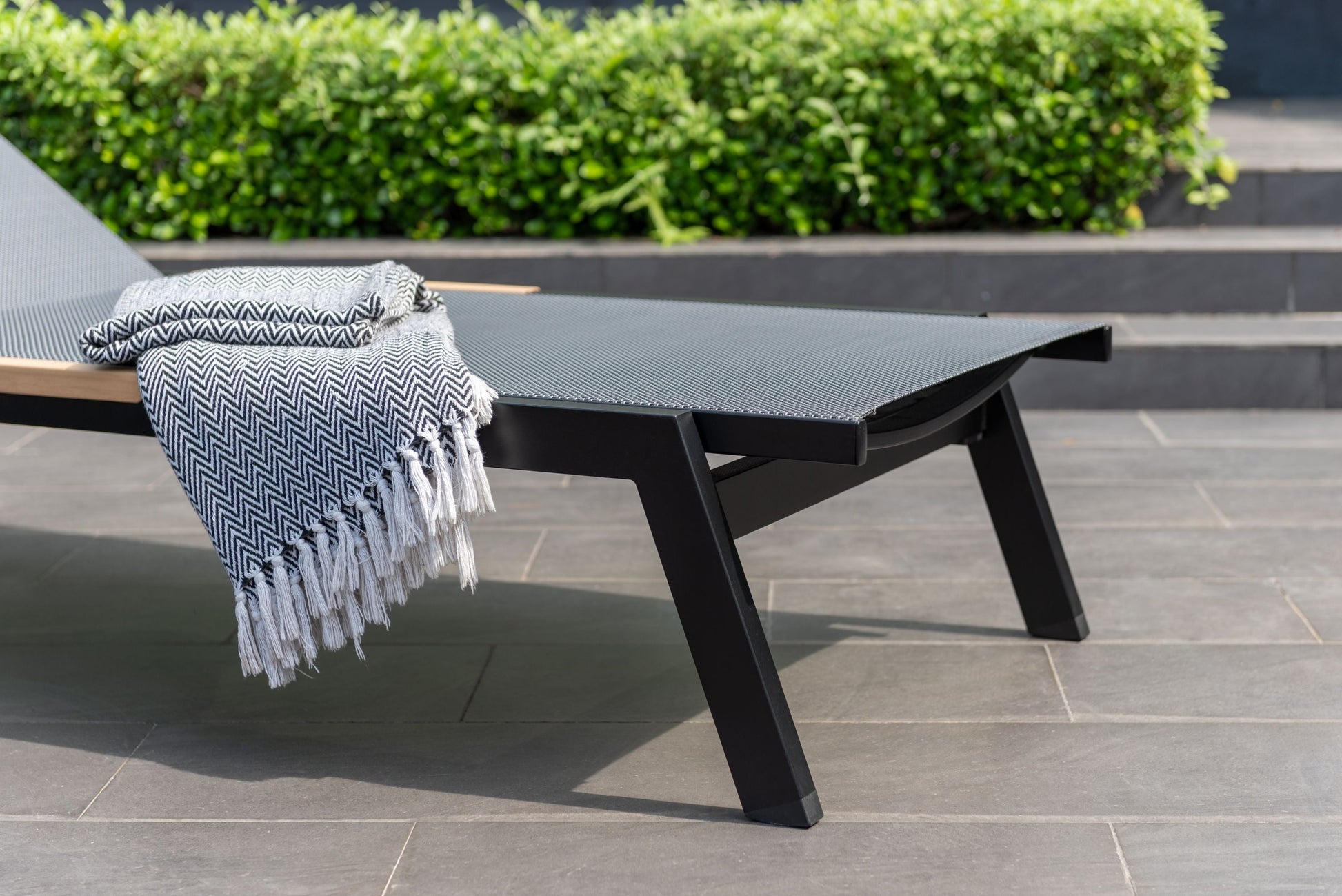 Panama Dark Sun Lounger with black frame and woven mesh surface by LifestyleGarden US on Tampa Home & Garden Store