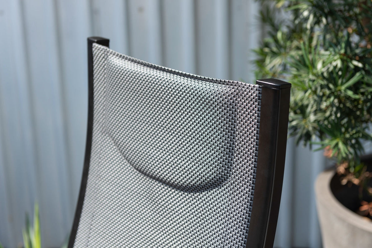 Panama Dark Stacking Armchair with black woven mesh back and dark frame on Tampa Home & Garden Store