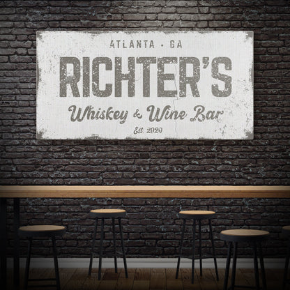 Personalized whiskey and wine bar sign canvas with distressed white plaque against brick on Tampa Home & Garden Store