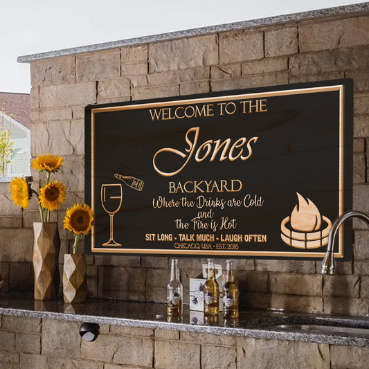 Backyard Sign by Tailored Canvases, black with copper lettering and wine glass campfire icons on Tampa Home & Garden Store