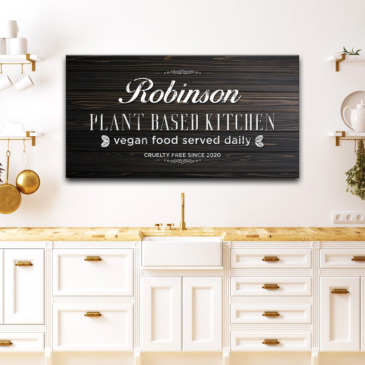 Plant Based Kitchen Sign canvas by Tailored Canvases with dark wood backdrop, white typography on Tampa Home & Garden Store