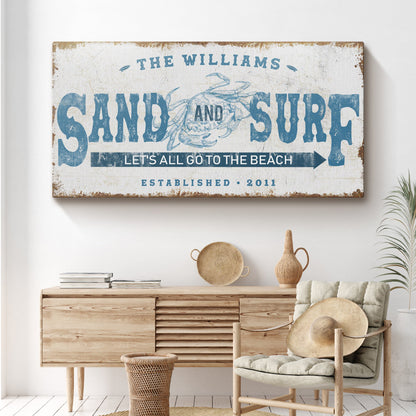 Sand And Surf sign canvas by Tailored Canvases with blue typography and crab motif on Tampa Home & Garden Store