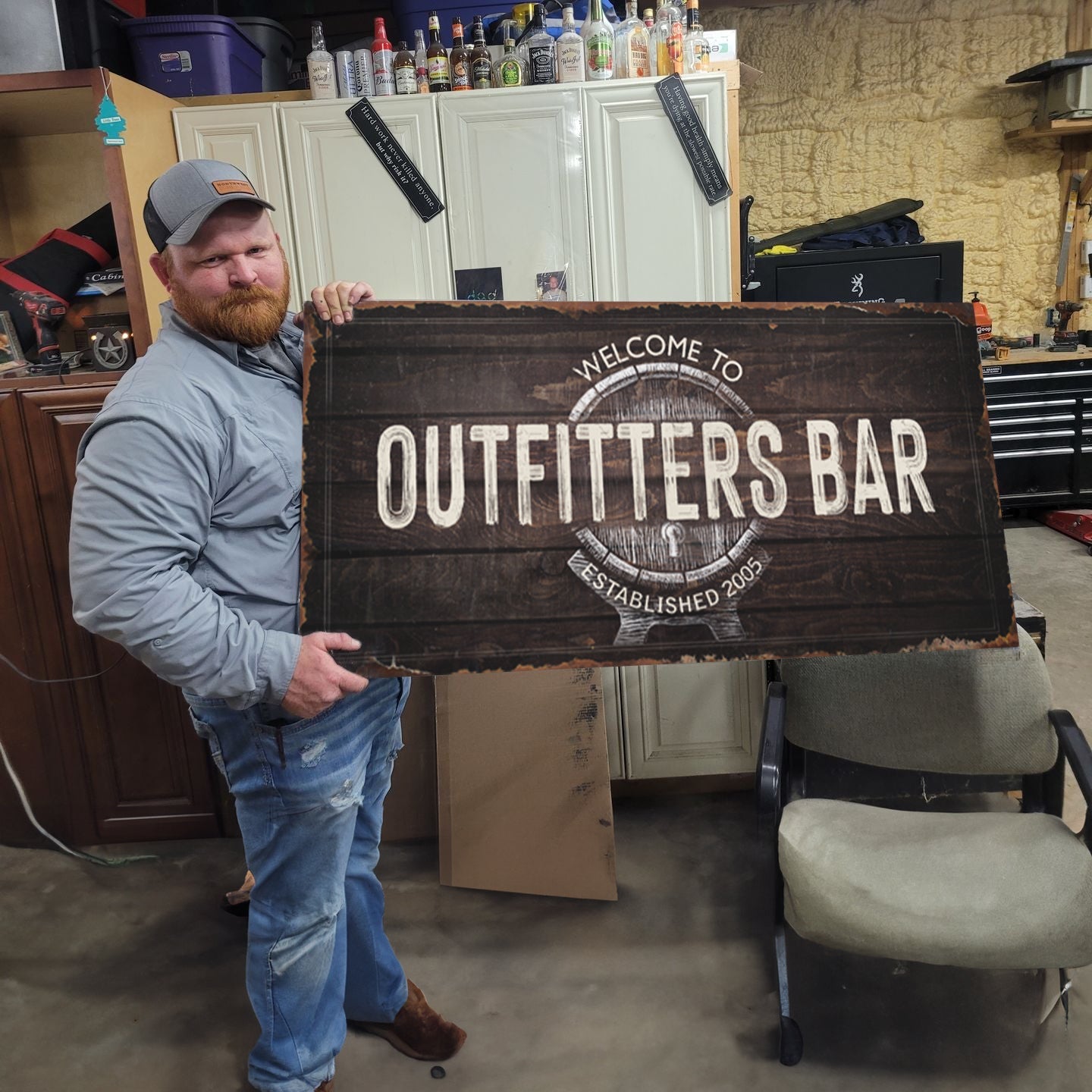Beer Barrel Bar Sign canvas by Tailored Canvases with rustic wood design held by man in a workshop on Tampa Home & Garden Store