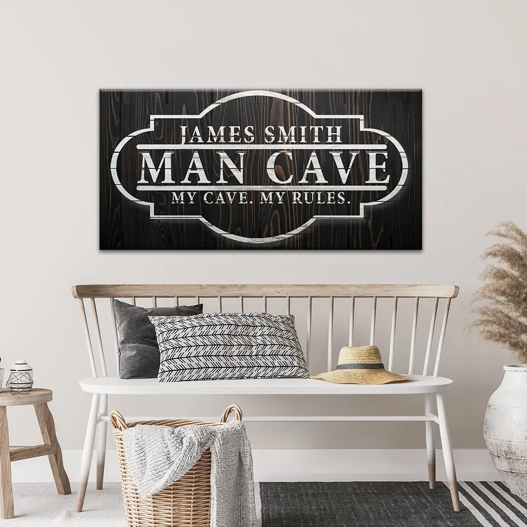Canvas sign My Cave My Rules by Tailored Canvases on dark woodgrain with white lettering on Tampa Home & Garden Store