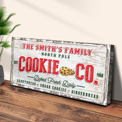 Canvas sign reads The Smith's Family North Pole with bold red COOKIE CO text and cookie graphic on Tampa Home & Garden Store