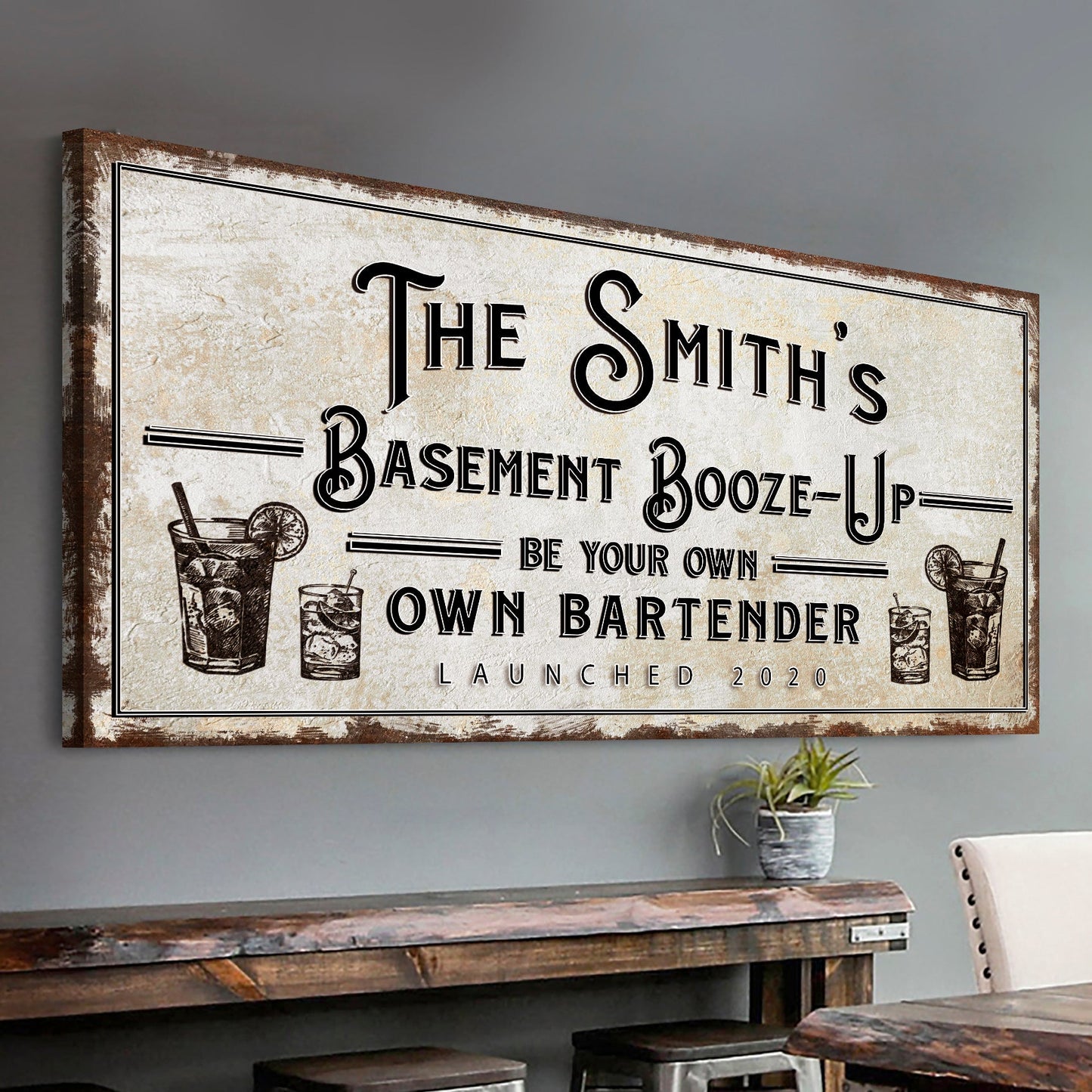 Basement Booze-Up canvas sign with distressed beige background and ornate black typography on Tampa Home & Garden Store