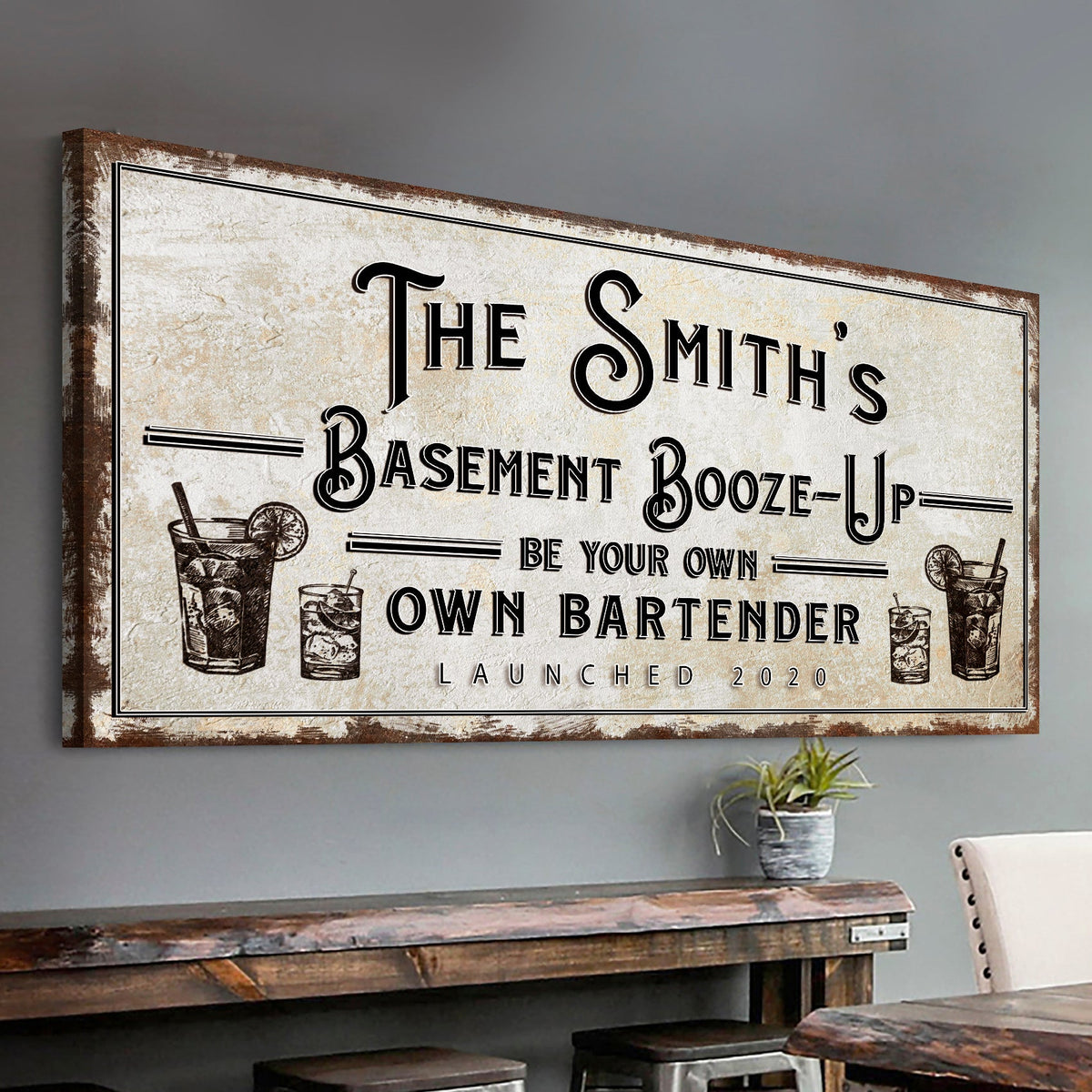 Basement Booze-Up canvas sign with distressed beige background and ornate black typography on Tampa Home & Garden Store
