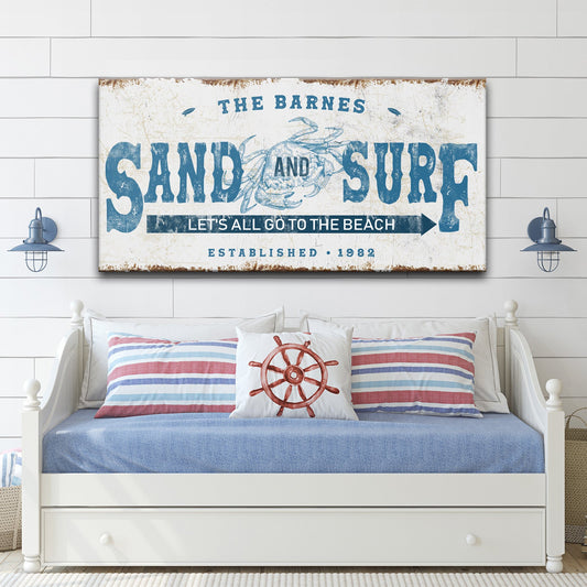 Sand and Surf Sign canvas by Tailored Canvases with distressed blue type and crab graphic on beach on Tampa Home & Garden Store