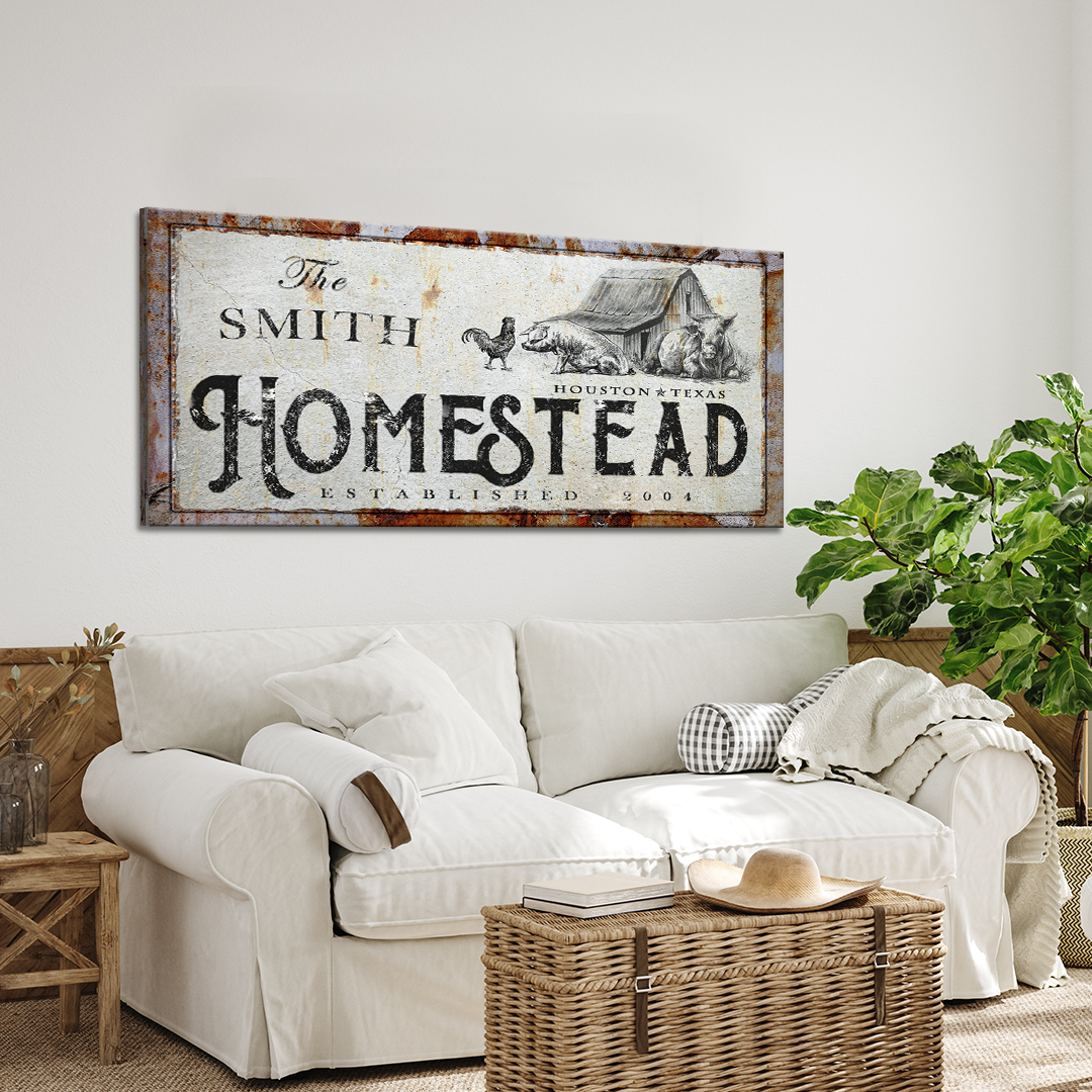 Homestead Sign canvas rustic wall art with HOMESTEAD lettering and farm imagery over a white sofa on Tampa Home & Garden Store