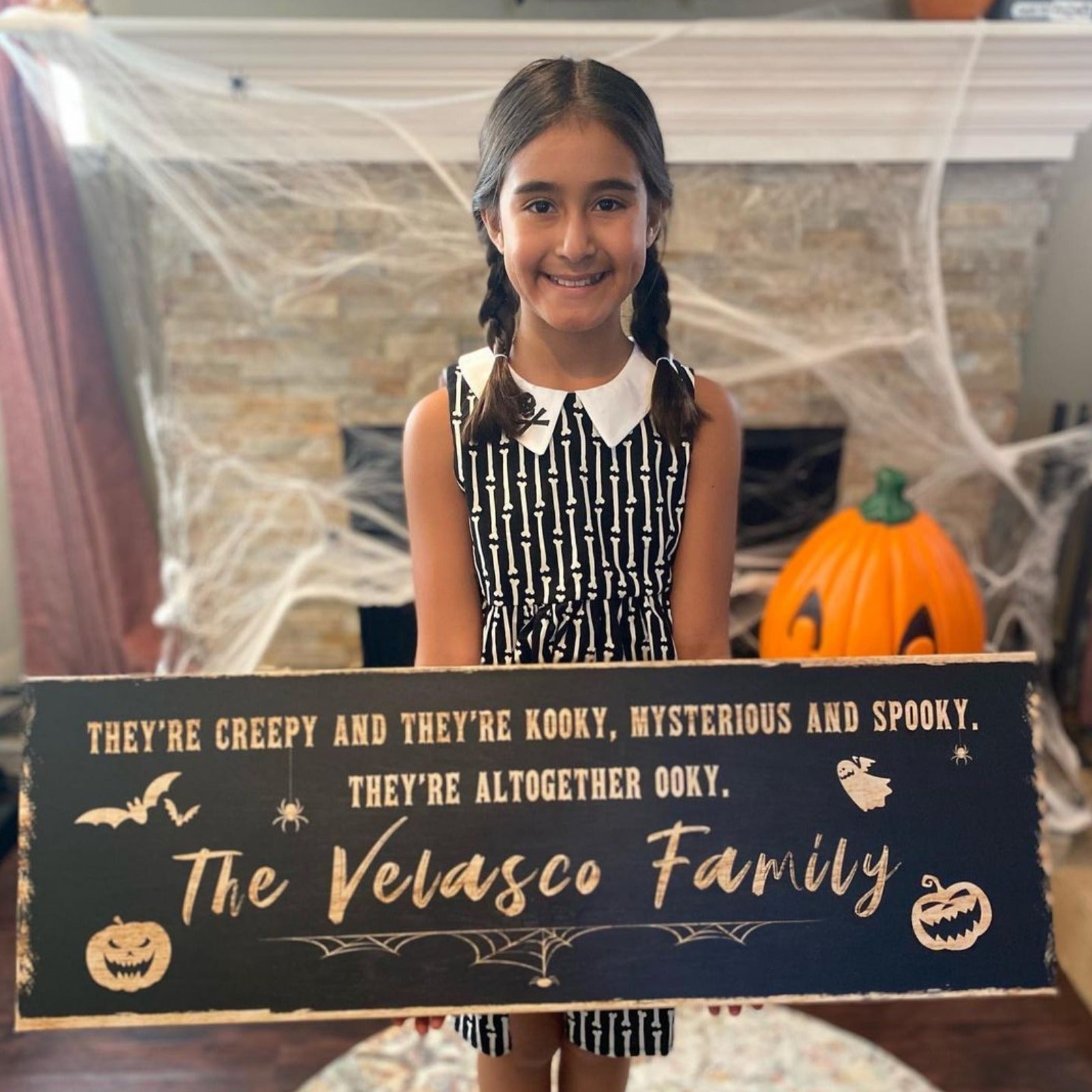 Creepy Family Sign Canvas by Tailored Canvases, dark blue with spooky text and pumpkins on Tampa Home & Garden Store