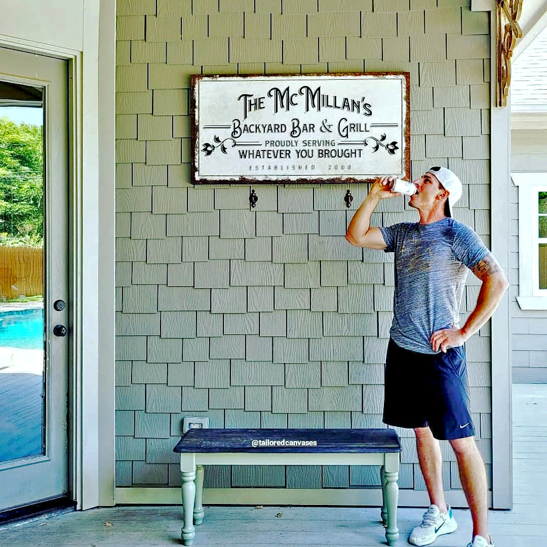 Backyard Bar & Grill sign canvas by Tailored Canvases, rustic framed wall art on gray shingles on Tampa Home & Garden Store