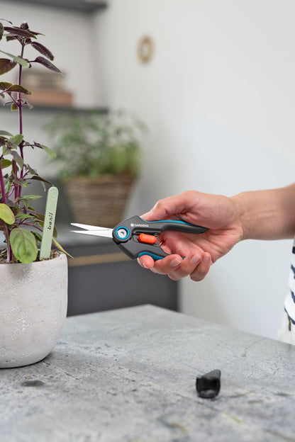 Gardena FreshCut Scissors hand pruner trimming basil in a pot, blue-gray handle on Tampa Home & Garden Store