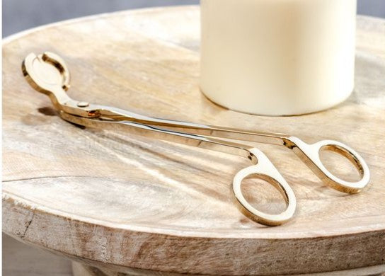 7-inch gold wick trimmer Thenestedfig with scissor-style handles on a wooden table on Tampa Home & Garden Store
