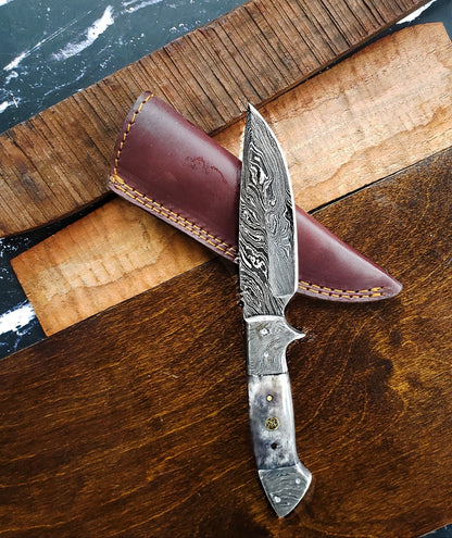 TD-005 Titan Damascus knife with swirled blade and metal handle, brown leather sheath on Tampa Home & Garden Store