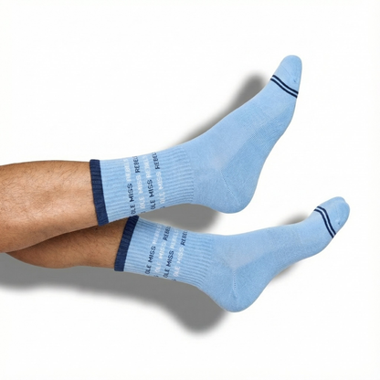 DeadSoxy Ole Miss Square 4-Pack crew socks in light blue with two navy stripes, worn on leg on Tampa Home & Garden Store