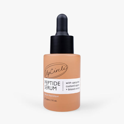 UpCircle peptide serum bottle with dropper, peach label and custard apple + blood orange text on Tampa Home & Garden Store
