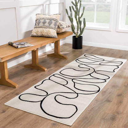 Eilir Modern Low Profile Boho Rug cream with black looping pattern by Boutique Rugs on Tampa Home & Garden Store