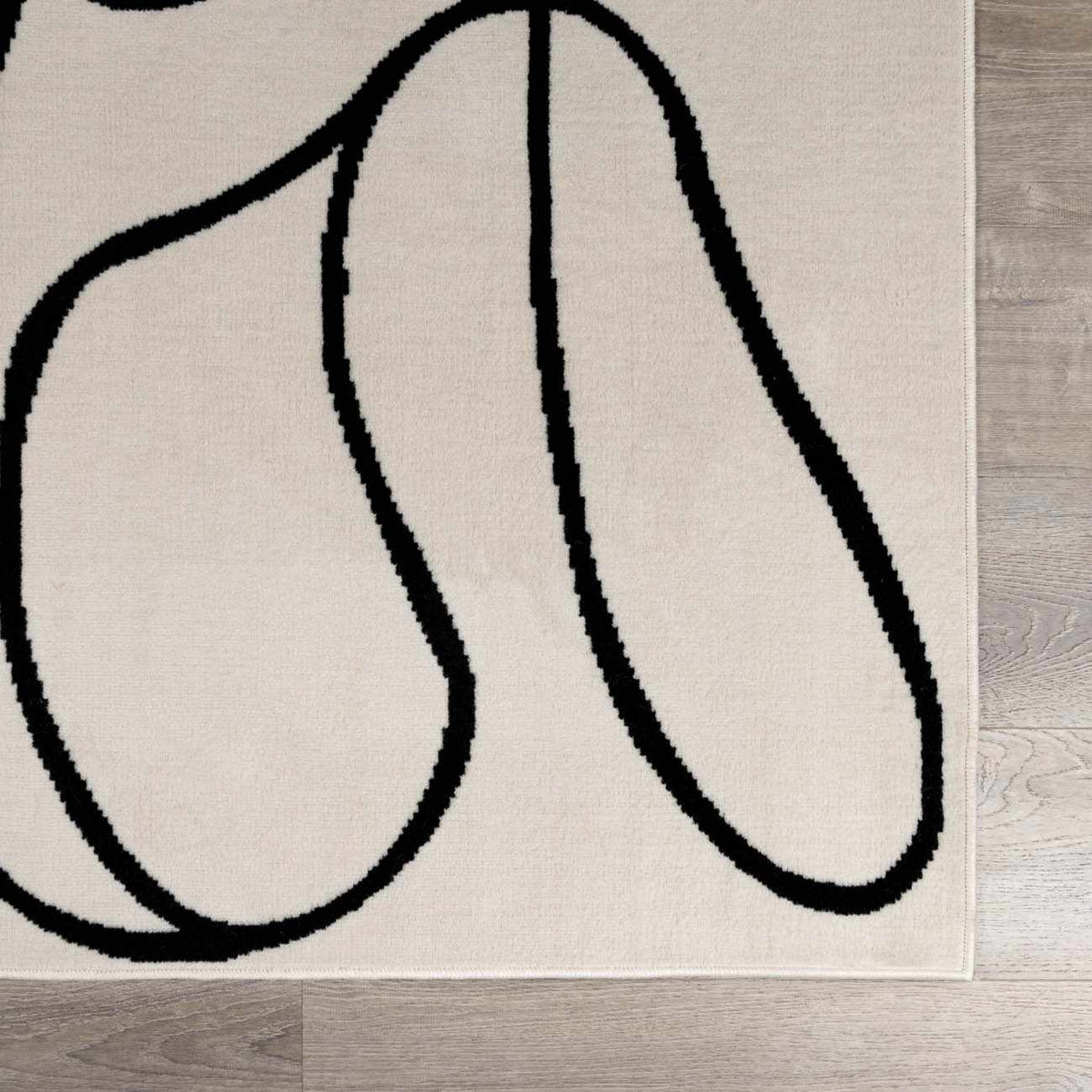 Eilir Modern Low Profile Boho Rug beige with bold black abstract loops Boutique Rugs on Tampa Home & Garden Store