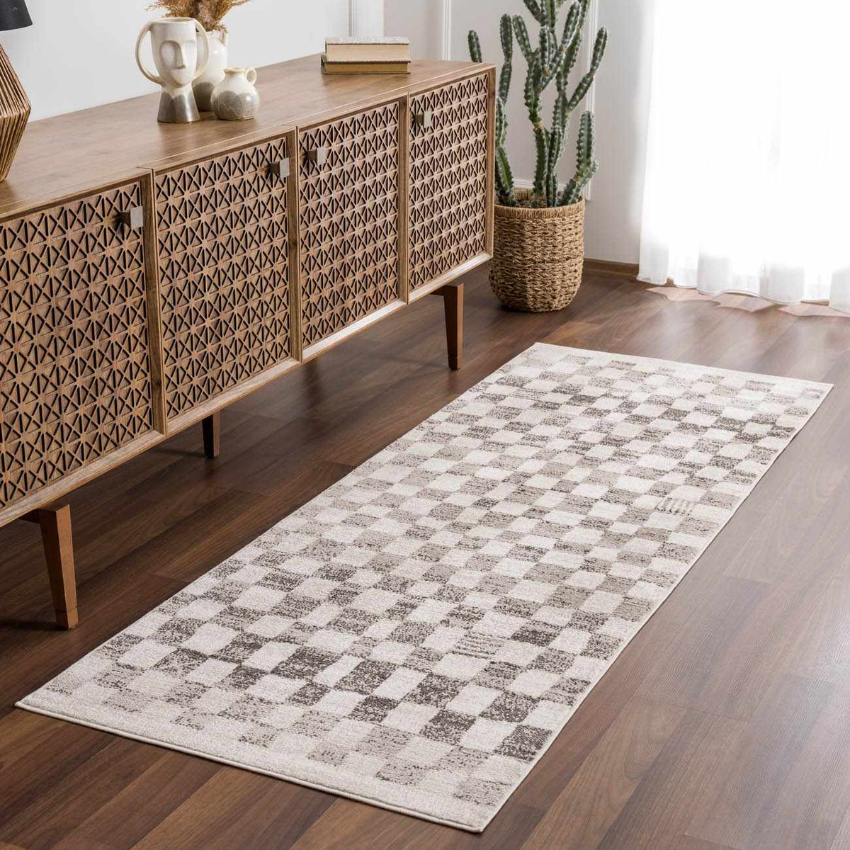 Benjy Irregular Checkboard Rug Beige runner by Boutique Rugs in a modern living room on Tampa Home & Garden Store
