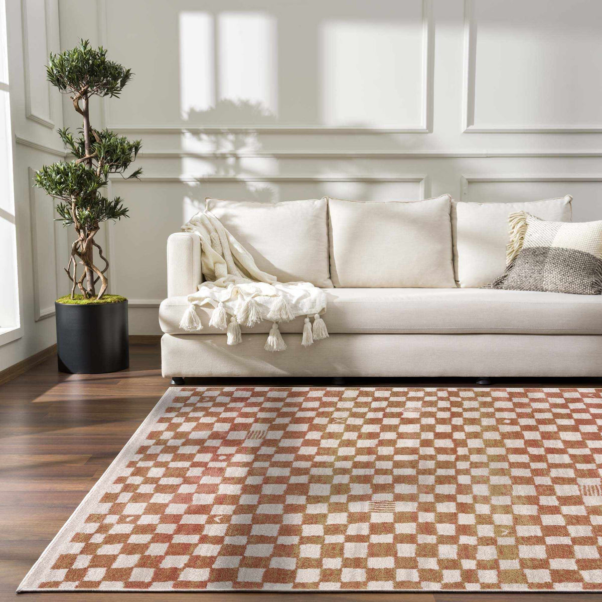 Benjy Irregular Checkboard Rug Cream & Salmon by Boutique Rugs in a cozy living room on Tampa Home & Garden Store