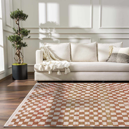 Benjy Irregular Checkboard Rug Cream & Salmon by Boutique Rugs in a cozy living room on Tampa Home & Garden Store