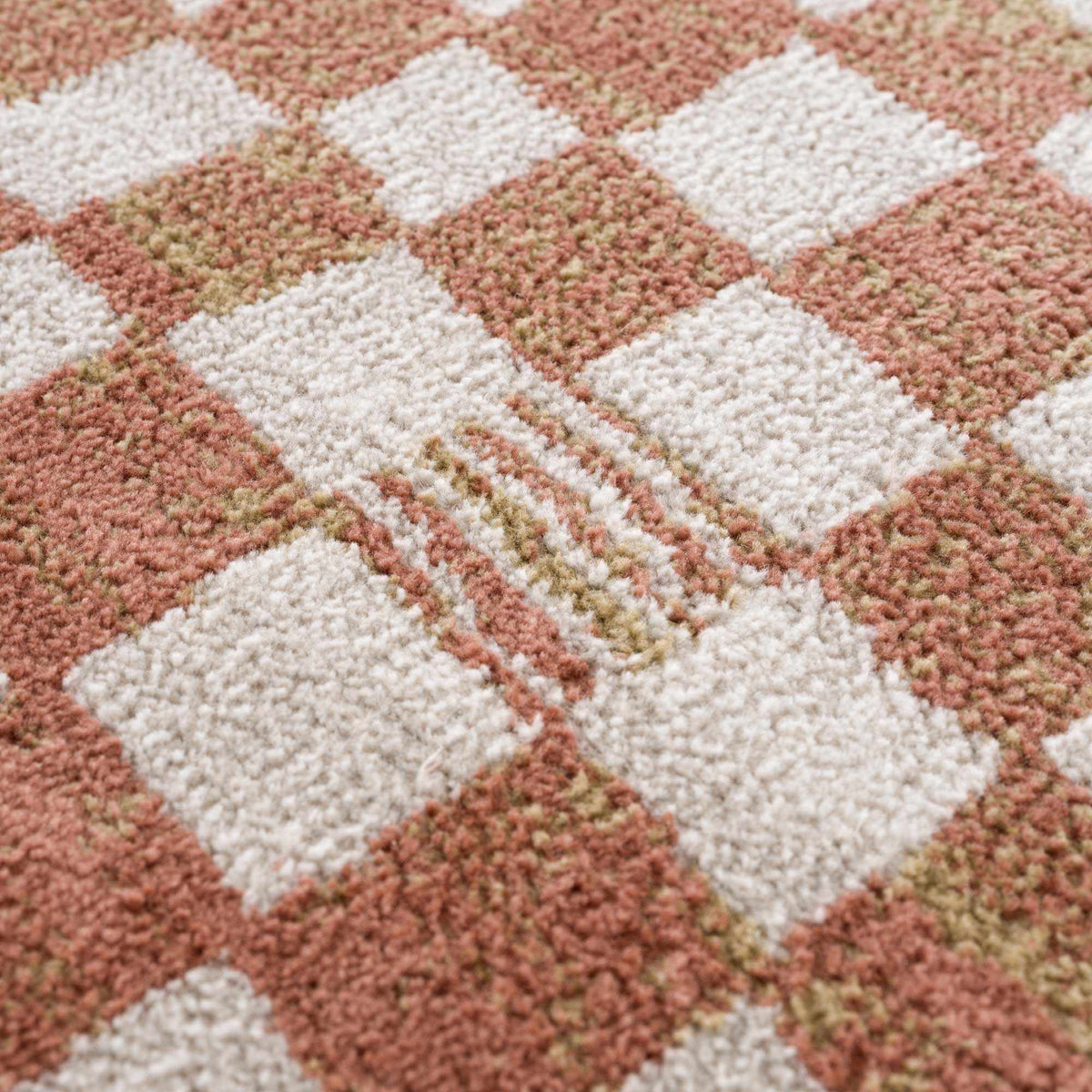 Benjy irregular checkboard rug cream and salmon tones Boutique Rugs on Tampa Home & Garden Store