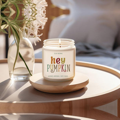 Baked pumpkin candle Gia Roma soy wax in cream jar with Hey Pumpkin label on a wooden tray on Tampa Home & Garden Store