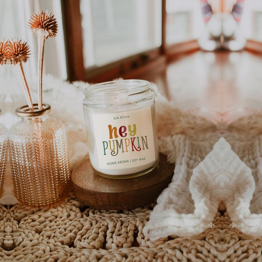 Baked Pumpkin candle Gia Roma in a clear soy wax jar with colorful label on wooden coaster on Tampa Home & Garden Store
