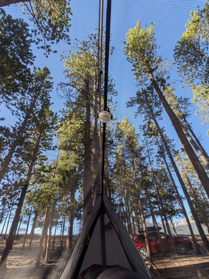 Sky View Solo Tent interior with gray fabric, mesh roof and central pole in a campsite on Tampa Home & Garden Store