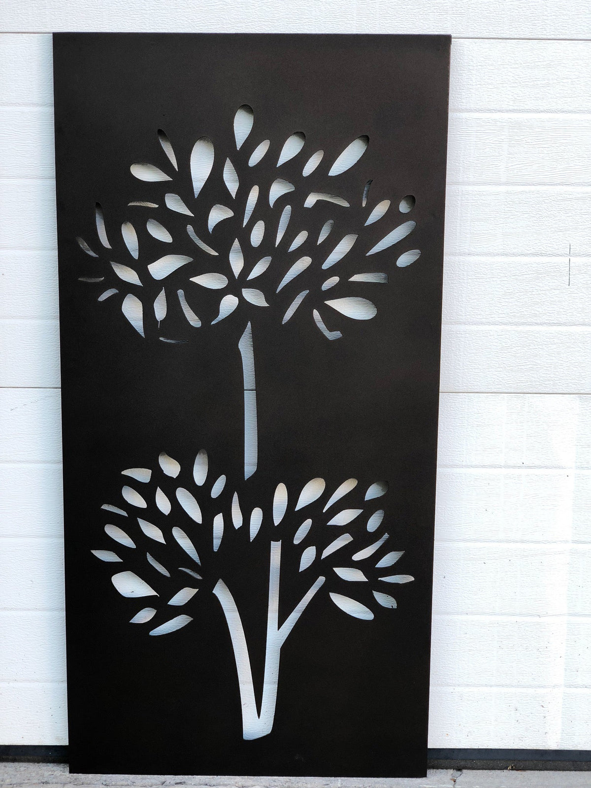 Pair of outdoor metal privacy panels with tree-cutout in black steel by Rustica Ornamentals on Tampa Home & Garden Store