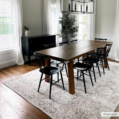 Parkerfield Area Rug by Boutique Rugs gray patterned rug under wooden dining table with black chairs on Tampa Home & Garden Store