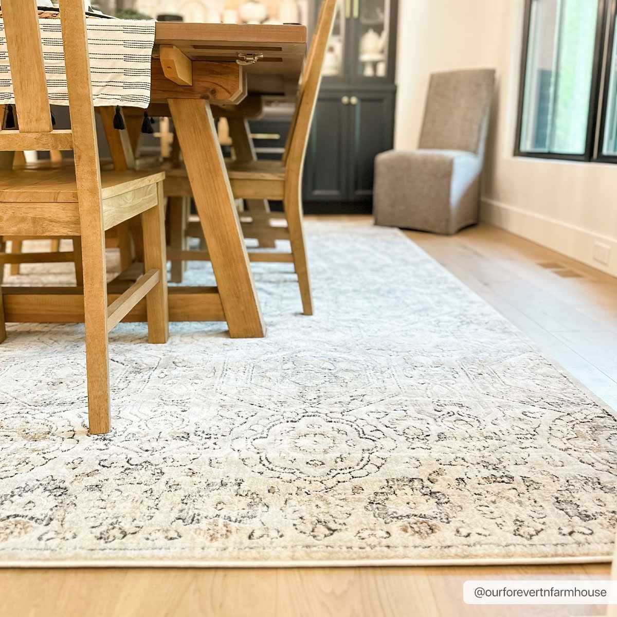 Parkerfield Area Rug under dining table with cream-gray medallion pattern Boutique Rugs on Tampa Home & Garden Store