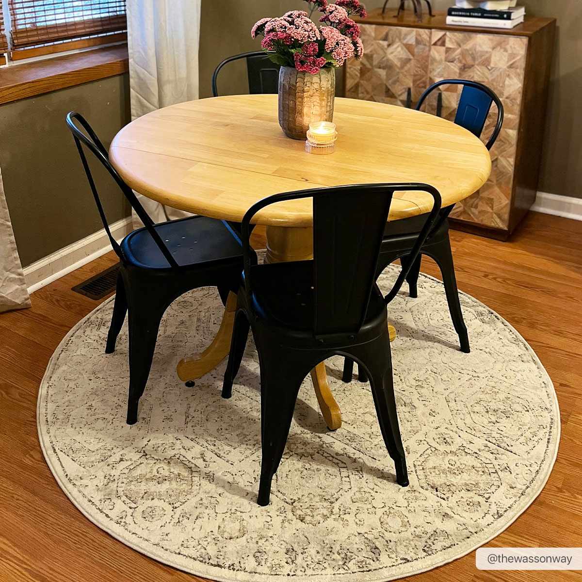 Parkerfield Area Rug by Boutique Rugs, round beige rug under dining table with black chairs on Tampa Home & Garden Store