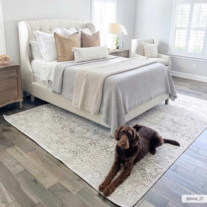 Parkerfield Area Rug, Boutique Rugs cream with gray pattern under a bed in a light bedroom on Tampa Home & Garden Store