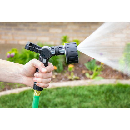 Orbit 6-pattern oversize hose nozzle with gray body and swivel handle spraying water on Tampa Home & Garden Store