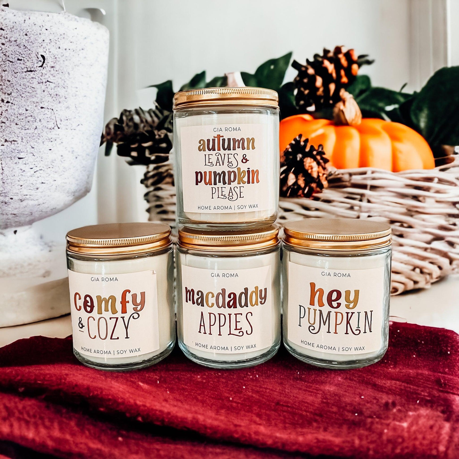 Mac Apple Candle Gia Roma in clear jar with copper lid among autumn decor pumpkins on Tampa Home & Garden Store