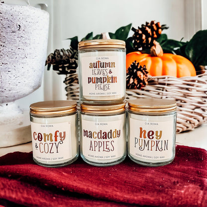 Mac Apple Candle Gia Roma in clear jar with copper lid among autumn decor pumpkins on Tampa Home & Garden Store
