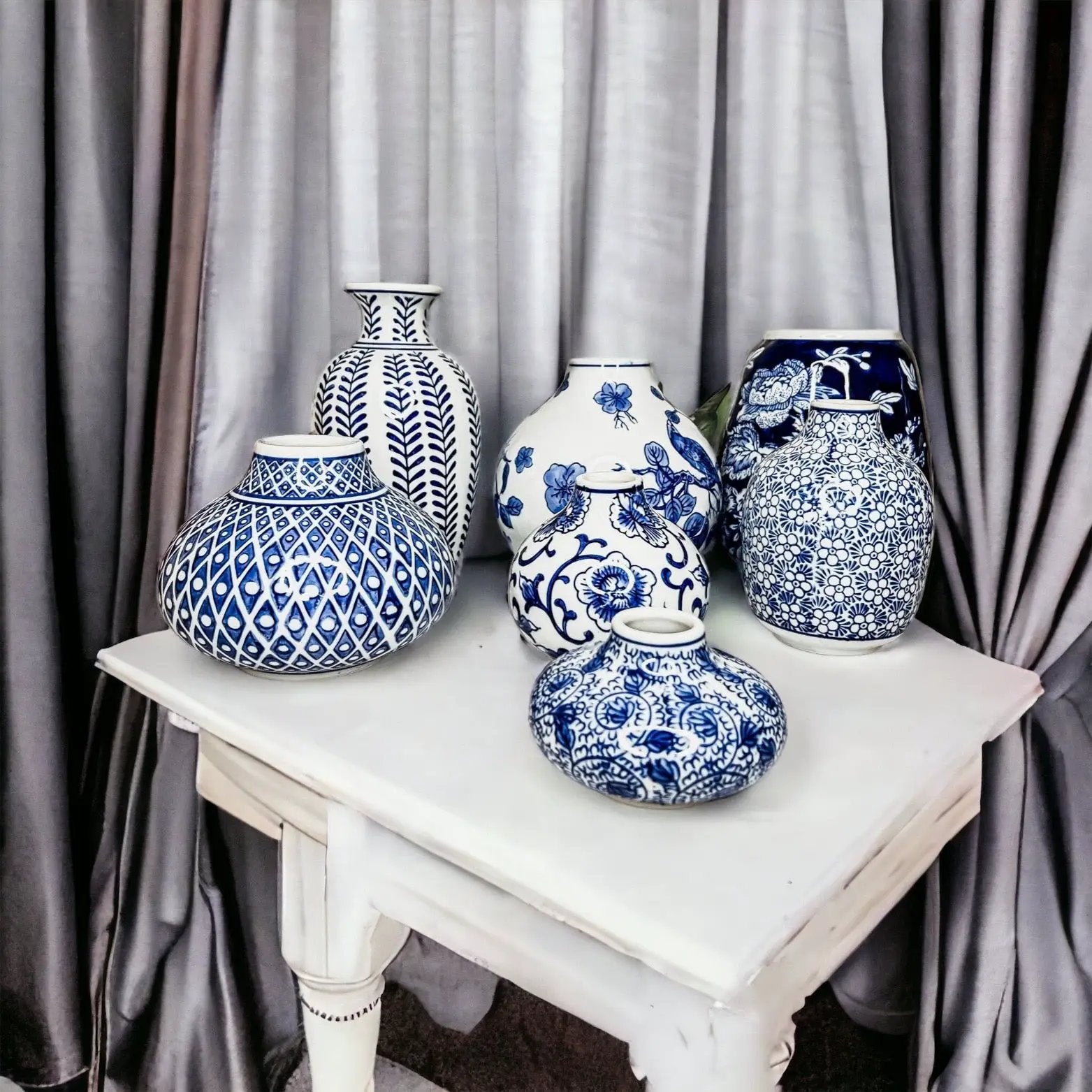 Samira Blue Porcelain Vases by Gia Roma, blue-and-white ceramic vases on a white table on Tampa Home & Garden Store