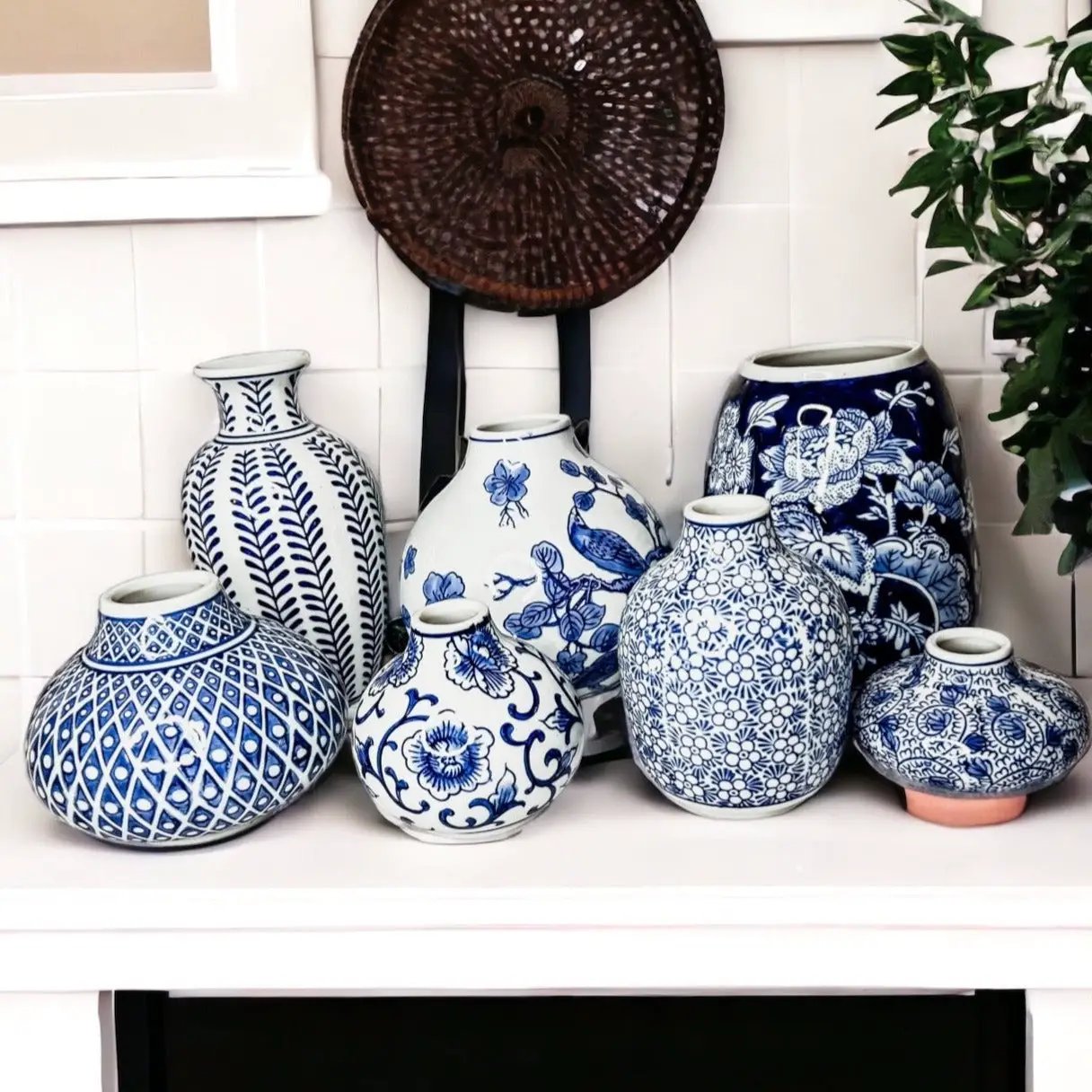 Samira blue porcelain vases in blue-and-white ceramic with floral patterns on a white shelf on Tampa Home & Garden Store