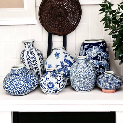 Samira blue porcelain vases in blue-and-white ceramic with floral patterns on a white shelf on Tampa Home & Garden Store