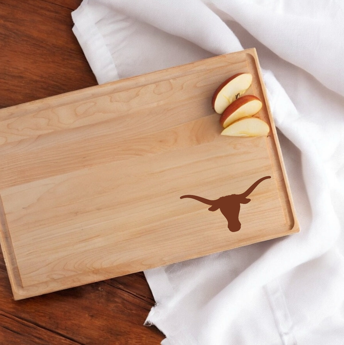 Texas Longhorns maple walnut hardwood cutting board with longhorn logo on natural wood on Tampa Home & Garden Store