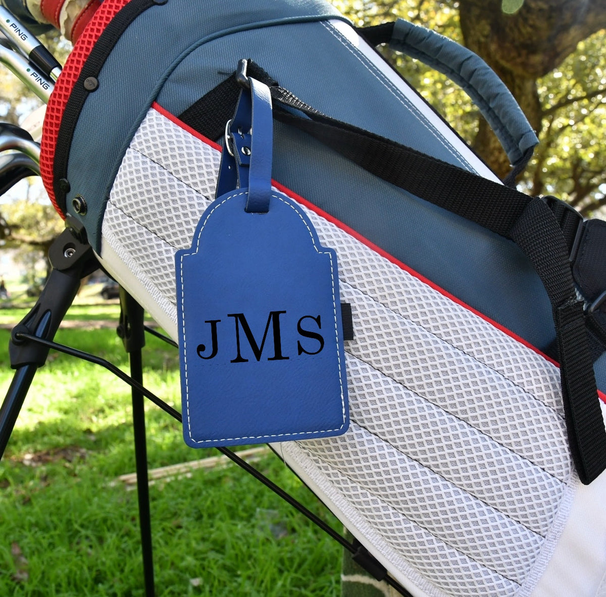 Texas A&M Leather Golf Tee Holder blue leather tag with white stitching attached to golf bag on Tampa Home & Garden Store