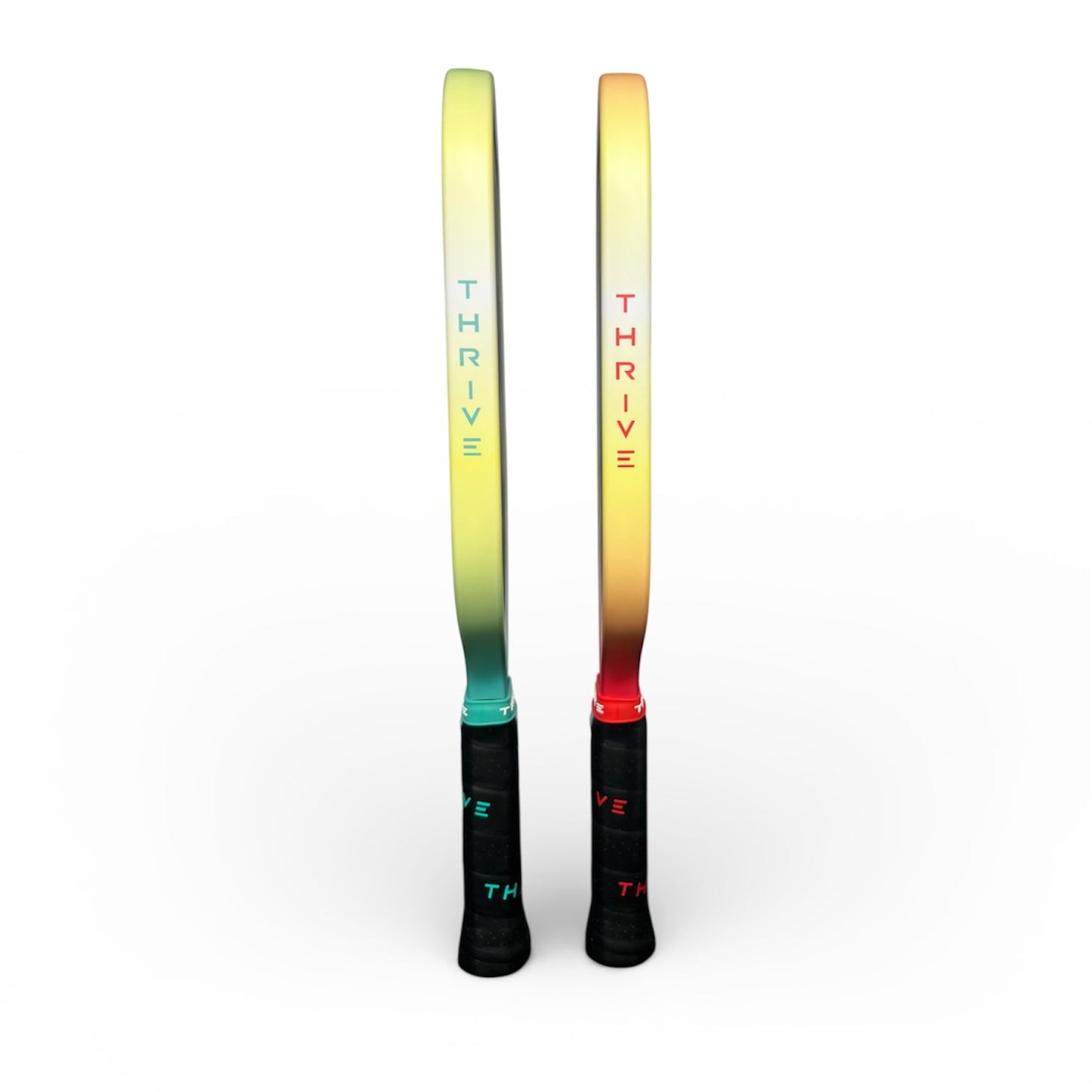 Thrive pickleball paddle pair in gradient teal-to-yellow and yellow-to-orange with THRIVE logos on shafts on Tampa Home & Garden Store